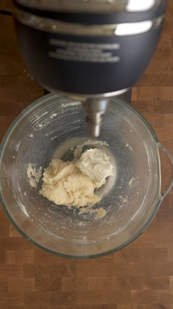 Add the cream cheese to the creamed butter and sugar