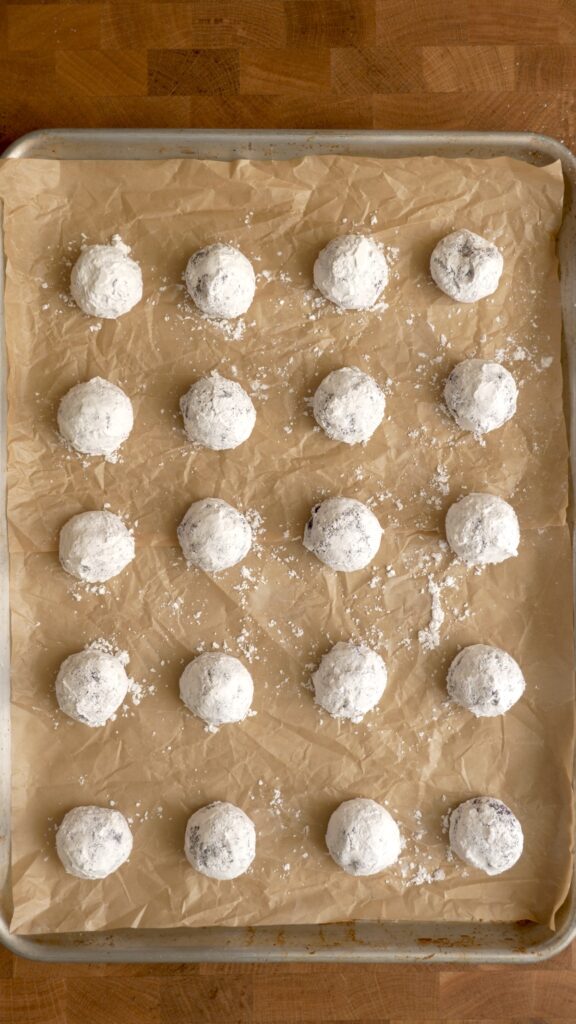 Cookies covered in powdered sugar before baking